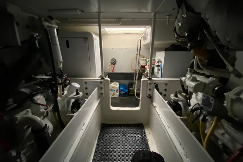 Slide: The Image of Engine room of a 2008 Silverton 45 Convertible yacht, showcasing mechanical components. - 47