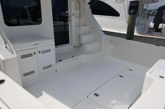 Slide: The Image of 2008 Silverton 45 Convertible yacht interior with white cabinetry and steps. - 6