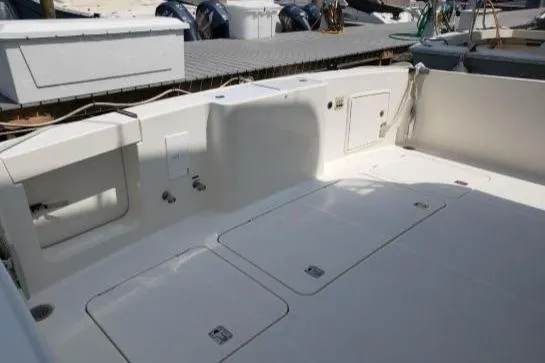 Slide: The Image of 2008 Silverton 45 Convertible boat deck with storage compartments and clean design. - 7