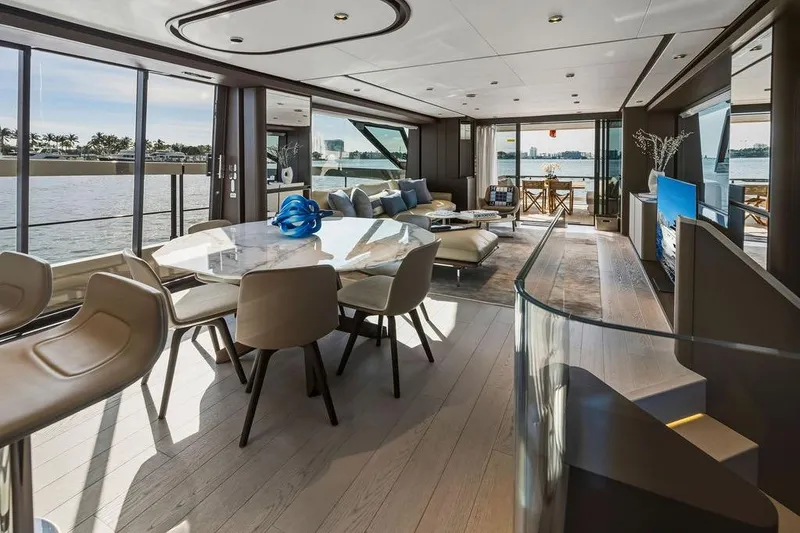 Slide: The Image of Luxurious interior of 2023 Ferretti Yachts 860 with elegant dining and lounge area. - 13