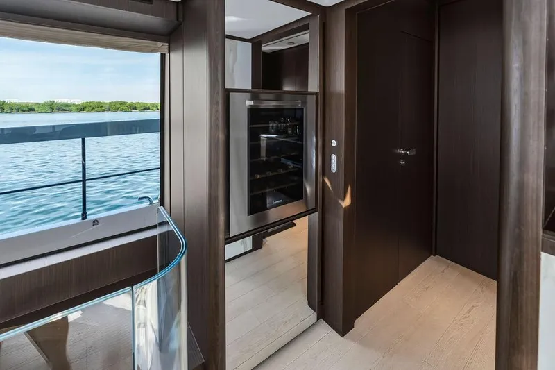 Slide: The Image of Luxurious interior of 2023 Ferretti Yachts 860 with modern design and scenic water view. - 15