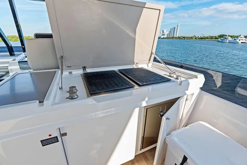 Slide: The Image of Outdoor kitchen on 2023 Ferretti Yachts 860, featuring grill and storage, with ocean view. - 32