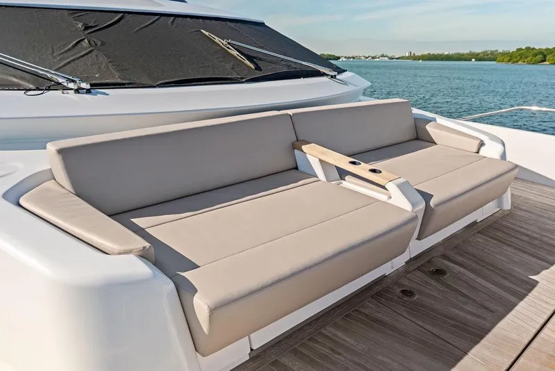 Slide: The Image of Luxury seating on 2023 Ferretti Yachts 860, overlooking serene waters. - 37