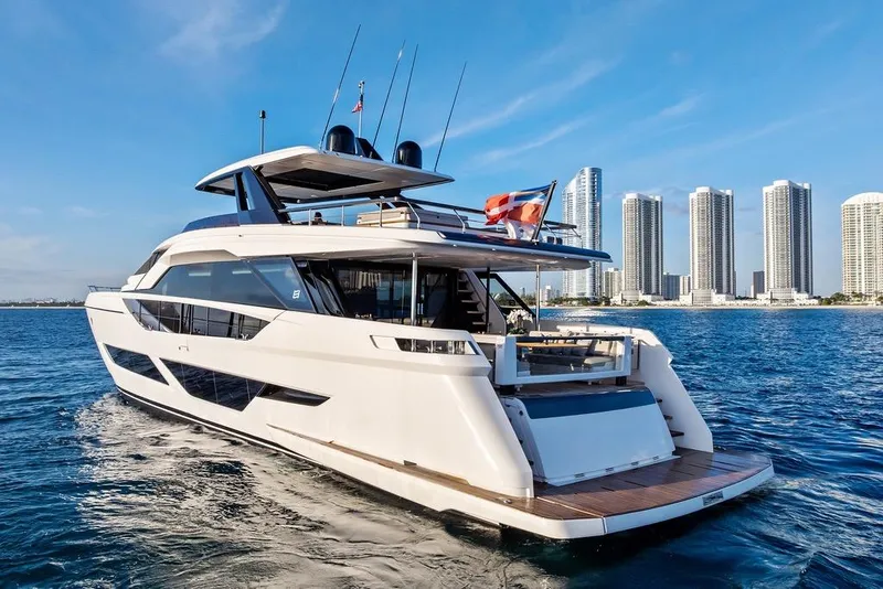 Slide: The Image of 2023 Ferretti Yachts 860 cruising near city skyline, luxury yacht on blue ocean. - 5