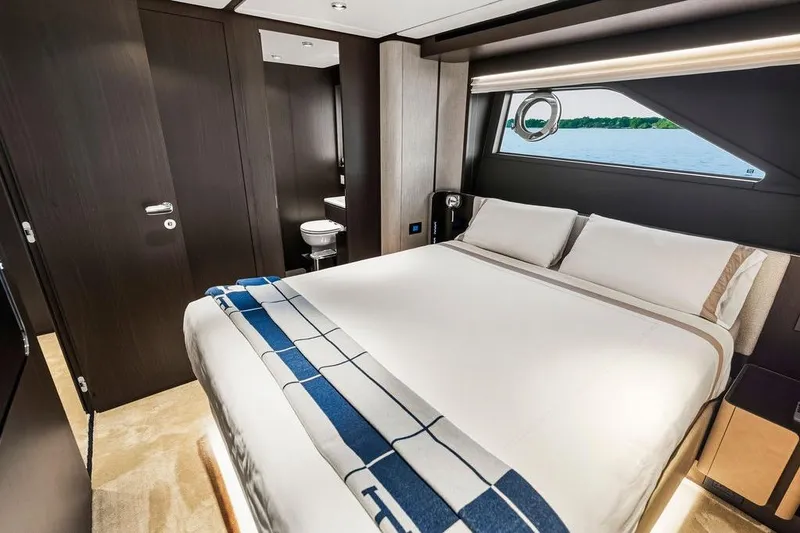 Slide: The Image of Luxurious bedroom interior of 2023 Ferretti Yachts 860 with modern design and scenic window view. - 51