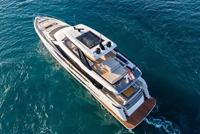 Slide: The Image of 2023 Ferretti Yachts 860 cruising on clear blue ocean waters. - 7