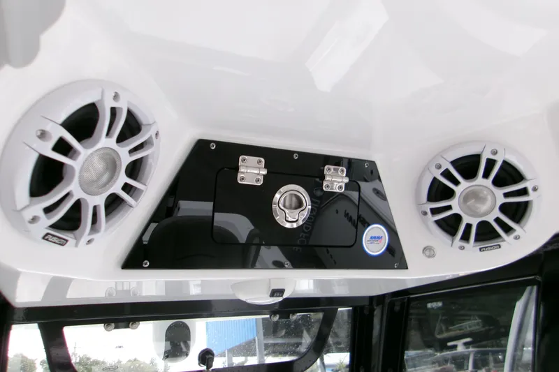 Slide: The Image of 2024 Sportsman Masters 267OE Bay Boat audio system with dual speakers and control panel. - 10