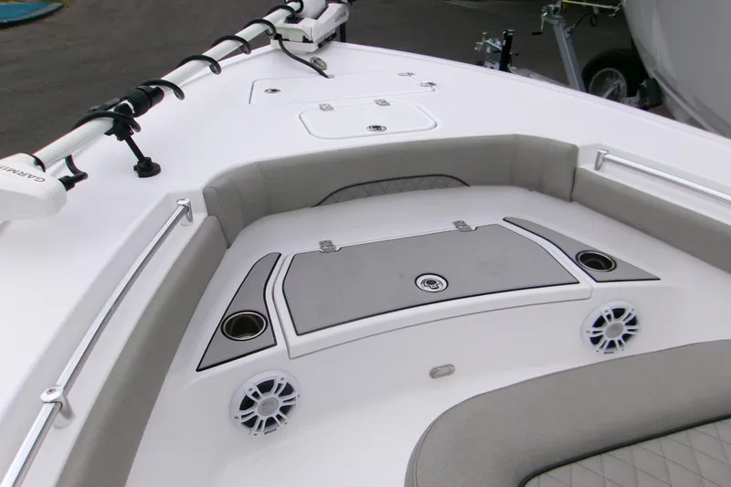 Slide: The Image of 2024 Sportsman Masters 267OE Bay Boat interior with seating and storage compartments. - 13