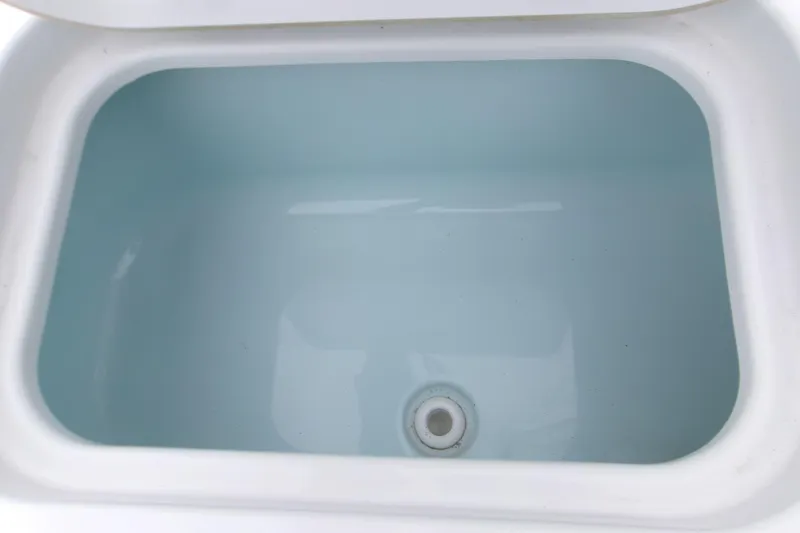 Slide: The Image of Livewell compartment in 2024 Sportsman Masters 267OE Bay Boat. - 16