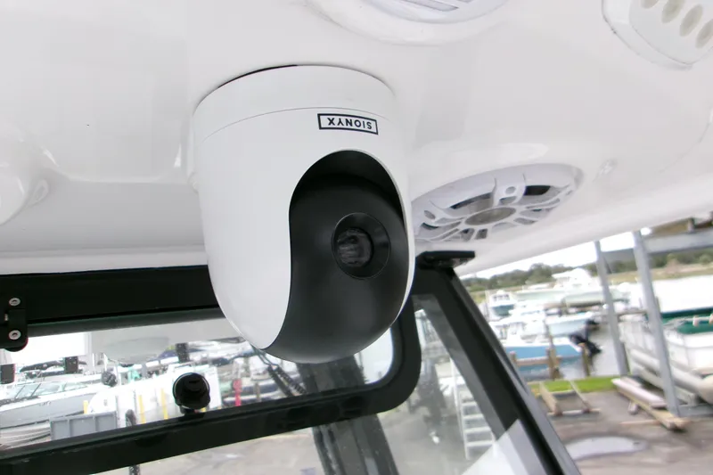 Slide: The Image of 2024 Sportsman Masters 267OE Bay Boat with mounted security camera and speaker system. - 17