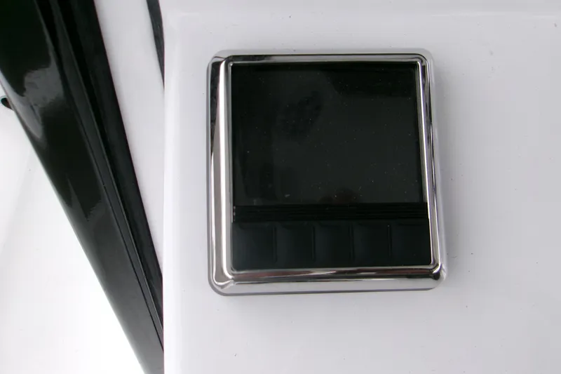 Slide: The Image of 2024 Sportsman Masters 267OE Bay Boat control panel, sleek design with chrome finish. - 19