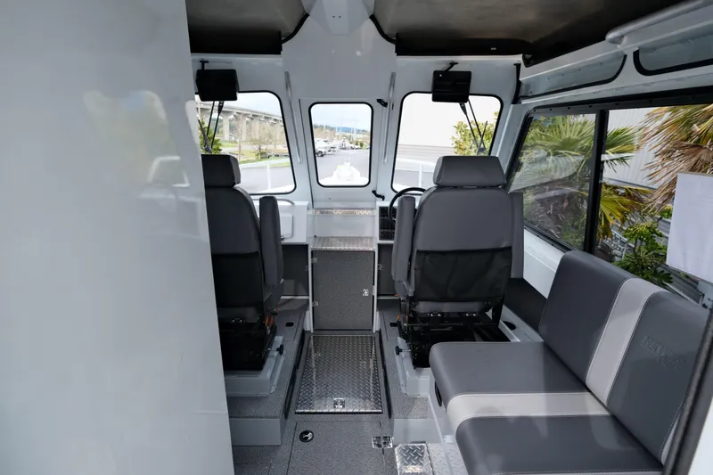 Slide: The Image of Interior of 2025 Hewescraft 250 Alaskan boat with seating and helm. - 10