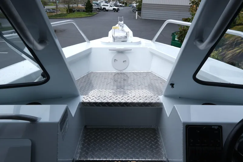 Slide: The Image of Interior view of 2025 Hewescraft 250 Alaskan boat, featuring diamond plate flooring. - 15