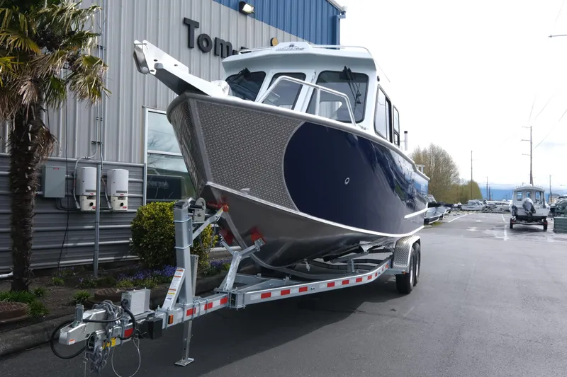 Slide: The Image of 2025 Hewescraft 250 Alaskan boat on trailer outside dealership. - 3