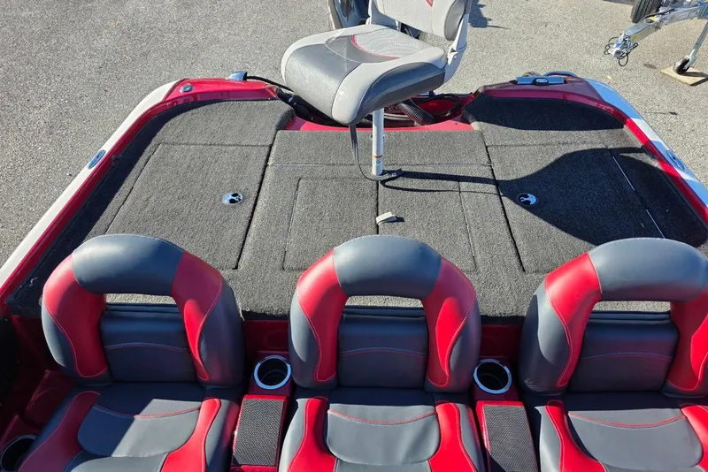 Slide: The Image of 2014 Nitro Z-7 boat interior with red and gray seating and fishing platform. - 19