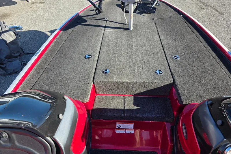 Slide: The Image of 2014 Nitro Z-7 boat deck with red accents and carpeted surface. - 9