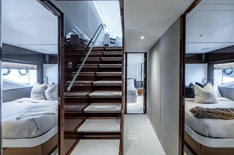 Slide: The Image of Luxurious interior of 2022 Princess X95 yacht featuring elegant bedrooms and staircase. - 107