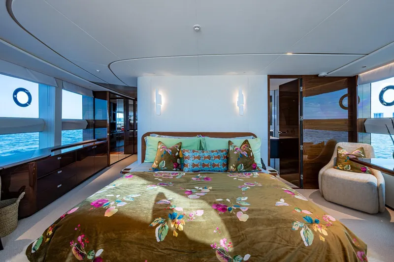 Slide: The Image of Luxurious 2022 Princess X95 yacht bedroom with ocean view and elegant floral decor. - 114