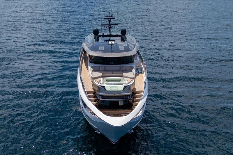 Slide: The Image of Luxury 2022 Princess X95 yacht on open water, showcasing sleek design and spacious deck. - 12