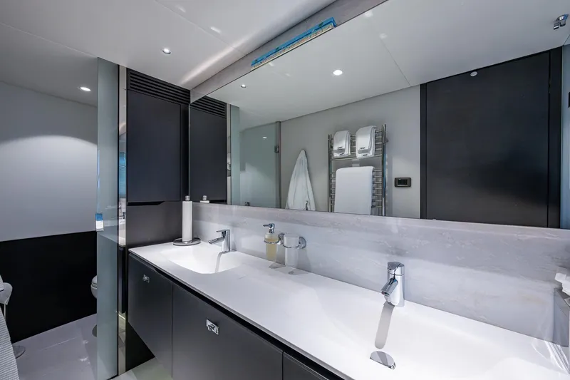 Slide: The Image of Luxurious bathroom interior on 2022 Princess X95 yacht, featuring dual sinks and modern design. - 122