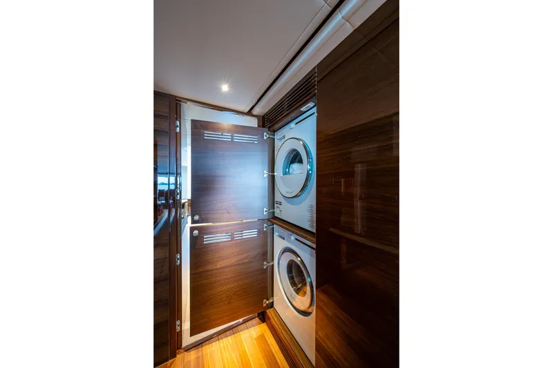 Slide: The Image of Laundry area with stacked washer and dryer on 2022 Princess X95 yacht. - 127