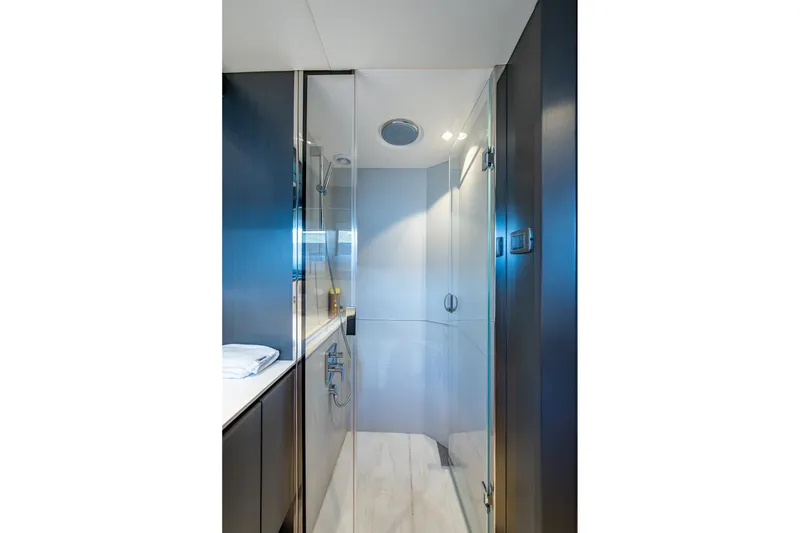 Slide: The Image of Luxurious bathroom interior on 2022 Princess X95 yacht, featuring sleek glass shower. - 137
