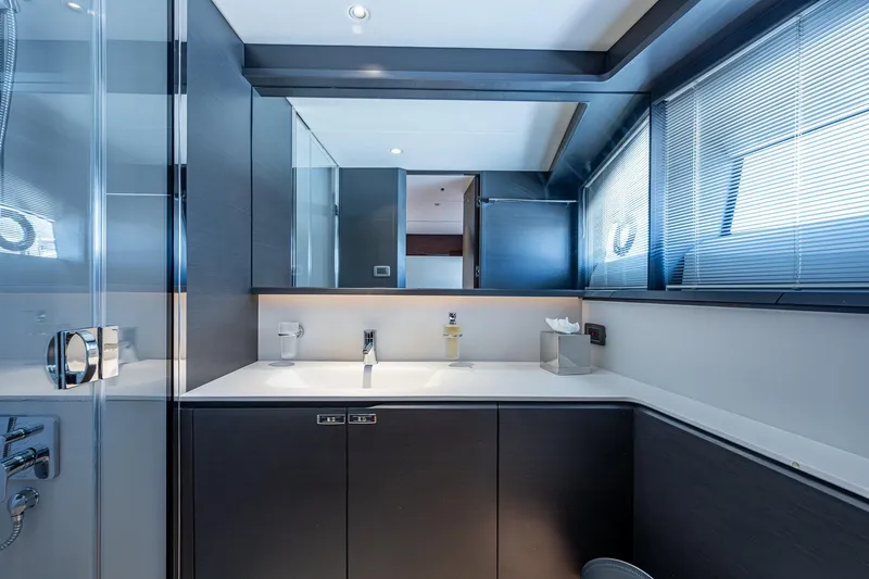 Slide: The Image of Luxurious bathroom interior on 2022 Princess X95 yacht, featuring sleek design and modern fixtures. - 145