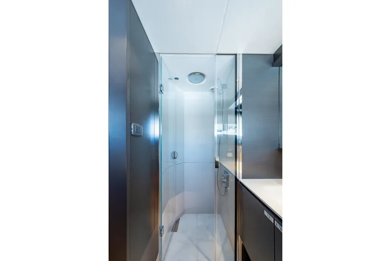 Slide: The Image of Luxurious bathroom interior on 2022 Princess X95 yacht, featuring sleek glass shower enclosure. - 146