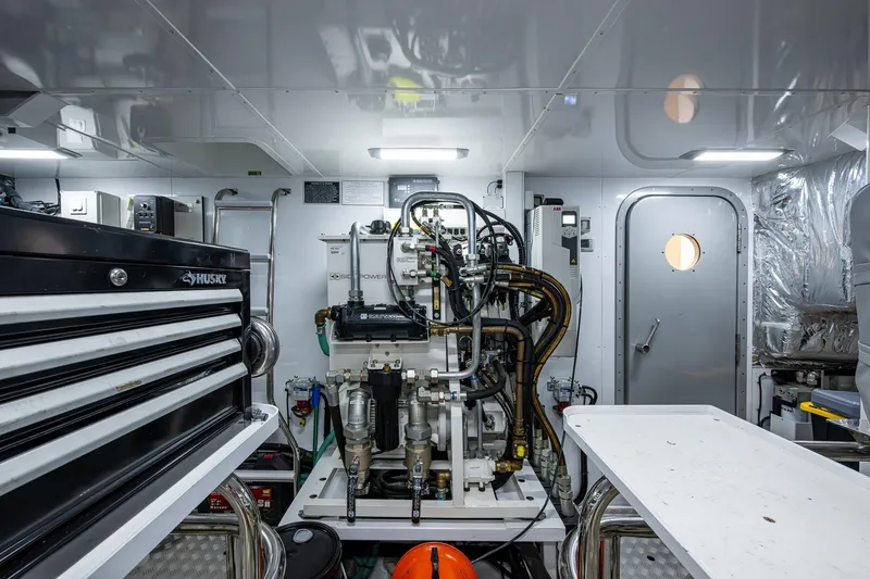 Slide: The Image of Engine room of 2022 Princess X95 yacht with machinery and tool storage. - 168