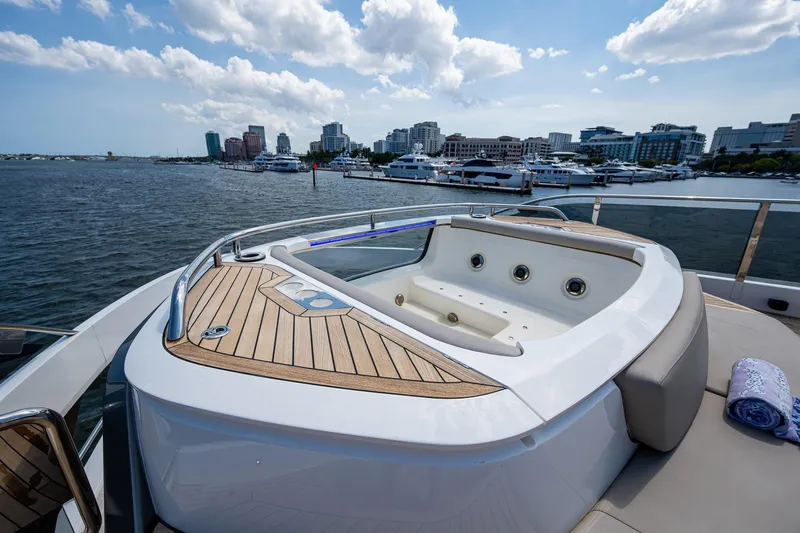 Slide: The Image of Luxurious 2022 Princess X95 yacht with jacuzzi, docked in a scenic marina. - 24