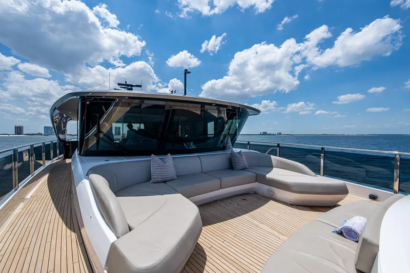 Slide: The Image of Luxurious 2022 Princess X95 yacht deck with plush seating, ocean view, and blue sky. - 26