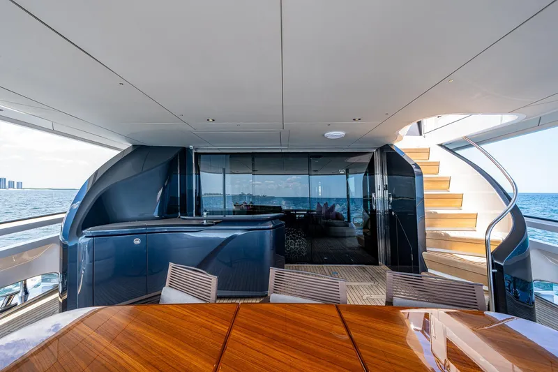 Slide: The Image of Luxurious 2022 Princess X95 yacht interior with elegant wood table and ocean view. - 36