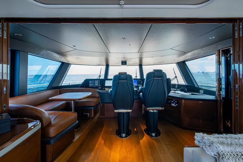 Slide: The Image of Luxurious 2022 Princess X95 yacht interior with leather seating and ocean view. - 44