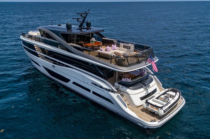Slide: The Image of Luxurious 2022 Princess X95 yacht cruising on open sea, featuring elegant design and spacious decks. - 5