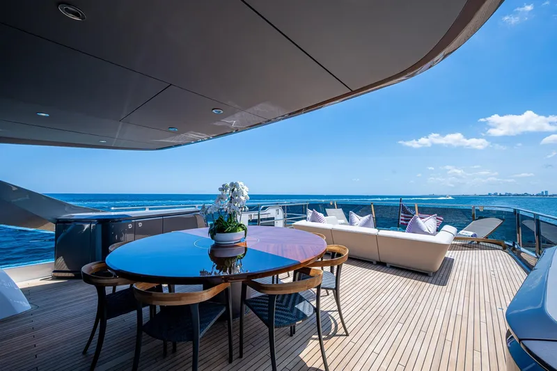 Slide: The Image of Luxurious 2022 Princess X95 yacht deck with dining area and ocean view. - 63