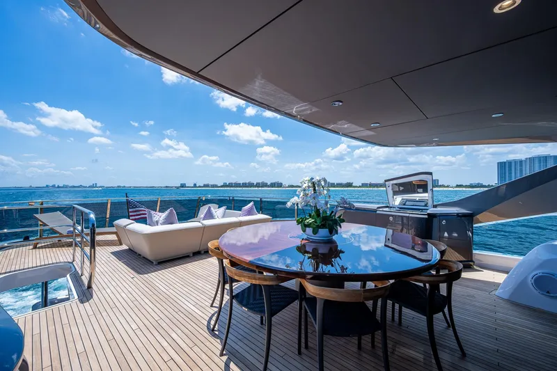 Slide: The Image of Luxurious 2022 Princess X95 yacht deck with dining area, ocean view, and modern amenities. - 64