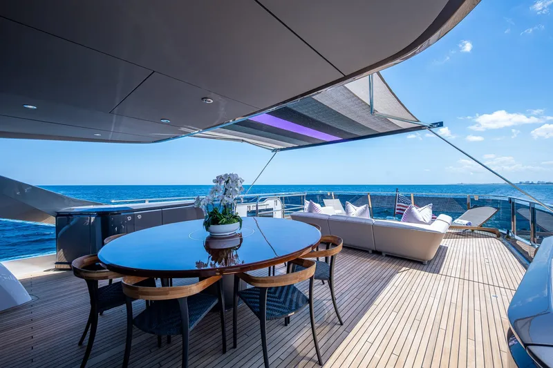 Slide: The Image of Luxurious 2022 Princess X95 yacht deck with elegant seating and ocean view. - 68