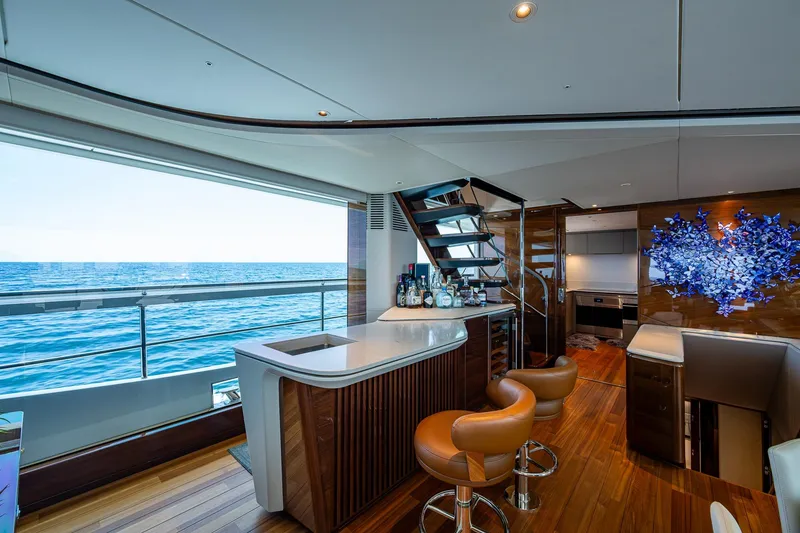 Slide: The Image of Luxurious interior of 2022 Princess X95 yacht with ocean view, bar, and modern decor. - 81