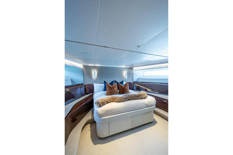 Slide: The Image of Luxurious bedroom interior of 2022 Princess X95 yacht with elegant decor and plush bedding. - 95