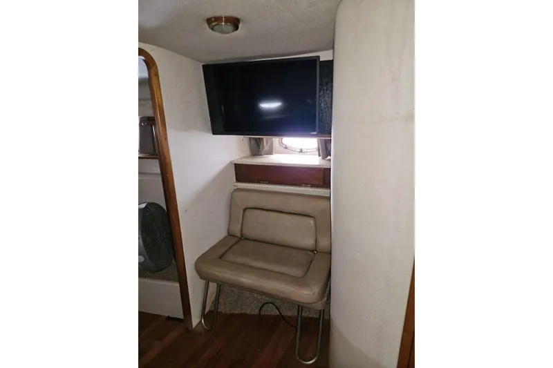 Slide: The Image of Interior of a 1992 Regal Commodore 400 boat with covered seating area. - 17