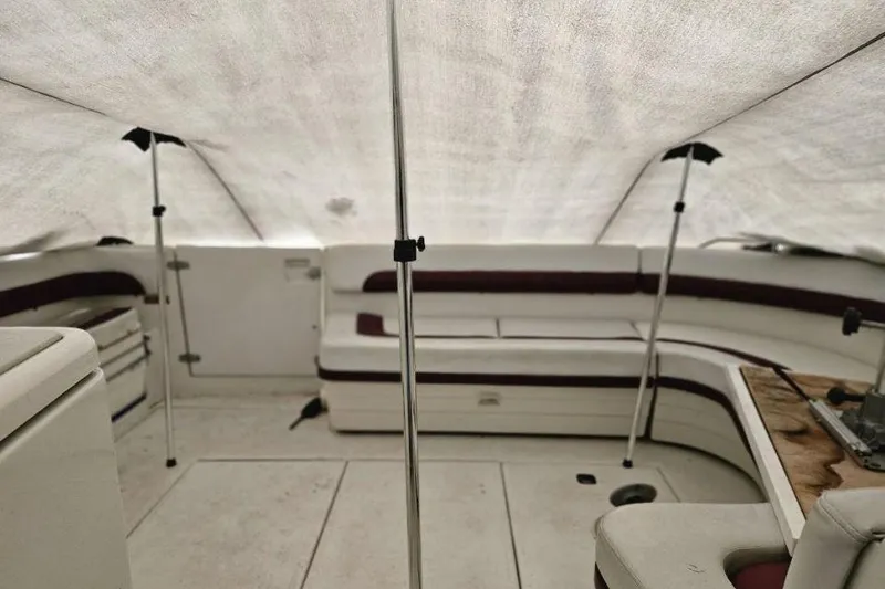 Slide: The Image of 1992 Regal Commodore 400 interior with TV, beige seating, and wooden accents. - 19