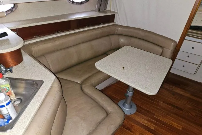 Slide: The Image of 1992 Regal Commodore 400 interior with beige leather seating and wooden flooring. - 25