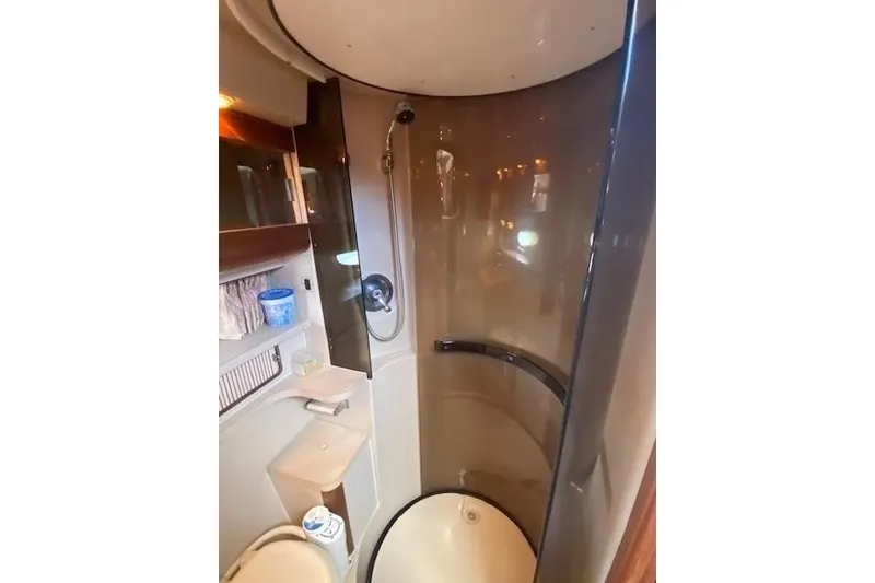 Slide: The Image of 1992 Regal Commodore 400 boat dashboard with steering wheel and control panel. - 3