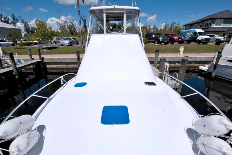 Slide: The Image of 1998 Luhrs 36 Convertible boat deck with scenic water view. - 12