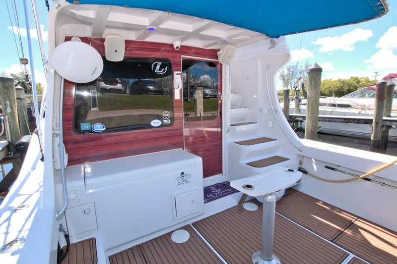 Slide: The Image of 1998 Luhrs 36 Convertible yacht cruising on a sunny day. - 15