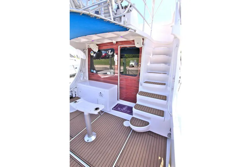 Slide: The Image of Bow view of 1998 Luhrs 36 Convertible yacht on calm water. - 17