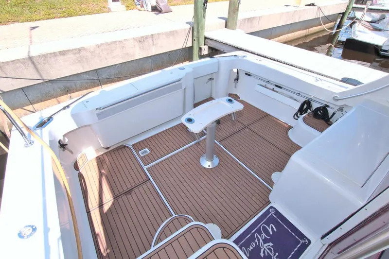 Slide: The Image of 1998 Luhrs 36 Convertible boat helm with navigation screens and controls. - 26