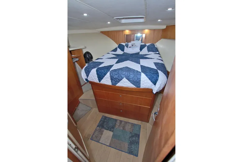 Slide: The Image of 1998 Luhrs 36 Convertible interior with kitchenette, microwave, and cabin entrance. - 37