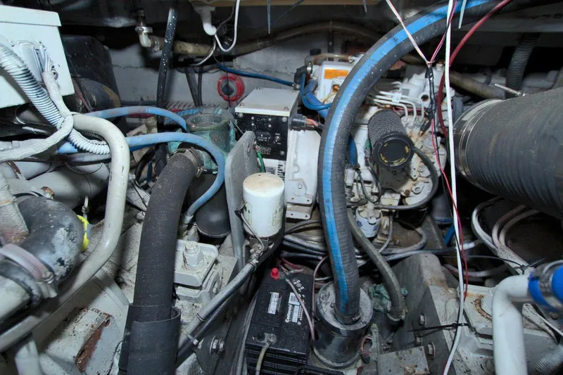 Slide: The Image of Engine room of 1998 Luhrs 36 Convertible boat with mechanical equipment and wiring. - 54