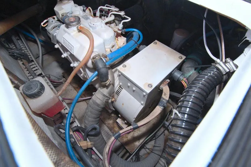 Slide: The Image of Engine room of 1998 Luhrs 36 Convertible boat with visible machinery and components. - 58